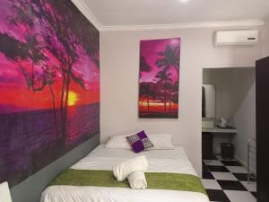 Postel nebo postele na pokoji v ubytování Sunset Sands