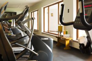 a gym with two treadmill machines and a window at Hotel Guadalajara Plaza Ejecutivo in Guadalajara