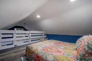 a bedroom with a bed and a white rail at Blue Bay Suite! Near Downtown and Foodie Hot Spots in Tampa