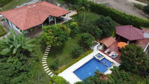 an aerial view of a house with a swimming pool at FINCA LUNADAR ANAPOIMA in Anapoima