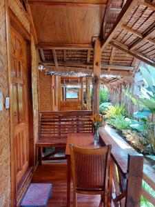 a dining room with a table and chairs at Jake and Zyra Place in San Vicente