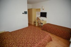 Postel nebo postele na pokoji v ubytování Hotel Canada