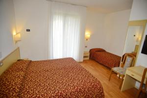 Postel nebo postele na pokoji v ubytování Hotel Canada
