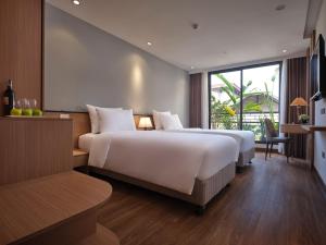 Postel nebo postele na pokoji v ubytování Minasi Hotel & Spa + 33 fotografií