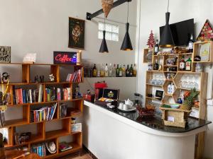 a bar in a room with books at Bloom Garden Bed & Breakfast in Siem Reap