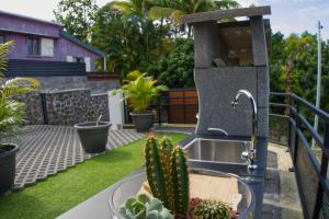 Zahrada ubytování Ka Hema - Maison entière avec Jacuzzi et vue sur mer
