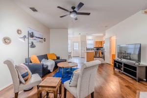 a living room with a couch and a tv at Cozy 2BD/3BA with Balcony/Patio/Free Parking/Fast Wifi! 5min to Downtown Plano! in Plano