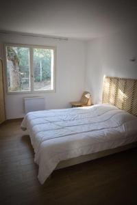 Postel nebo postele na pokoji v ubytování La Ronce des Pins Classe 3