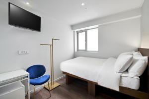 Cama ou camas em um quarto em H HOSTEL Itaewon