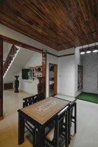 a dining room with a table and chairs at Le Robinet Villa - a journey into Hue citadel soul in Hue