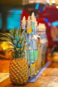 a pineapple sitting on top of a table at Pipes Hostel in Kuta Lombok