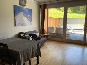 a room with a table and a view of a mountain at 3-Zimmer Appartement in Zwieselstein (Sölden) in Sölden