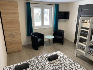TV a/nebo společenská místnost v ubytování Apartmán u Drahotů