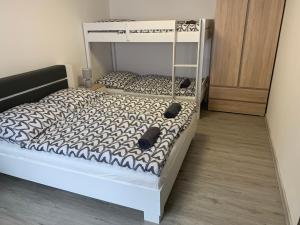 Postel nebo postele na pokoji v ubytování Apartmán u Drahotů