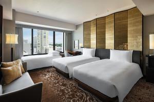 Postel nebo postele na pokoji v ubytování Hyatt Regency Yokohama