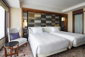 Postel nebo postele na pokoji v ubytování Hyatt Regency Yokohama