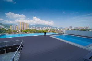 a person standing on the roof of a building at Avatel Jelutong PWCC in George Town