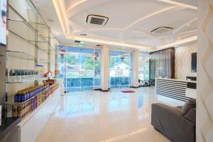 a lobby of a store with a couch and tables at Avatel Jelutong PWCC in George Town