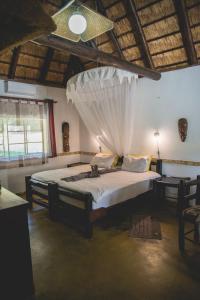Postel nebo postele na pokoji v ubytování Thokozani Lodge