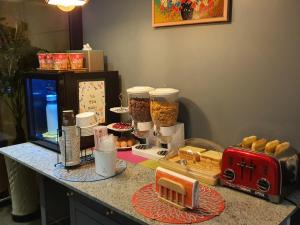 a counter with some food on a counter top at Hotel Frenchcode in Busan