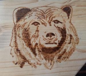 a drawing of a bear on a wooden table at Casa dell'orso in Rocca di Botte
