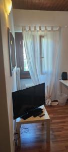 TV in/ali zabaviščno središče v nastanitvi Casa Zen