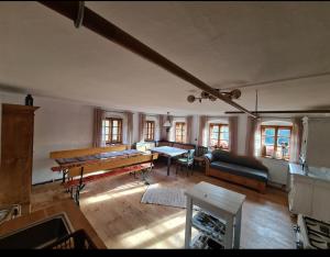 a living room with a table and a couch at Ferienhaus Klause in Neureichenau +40 photos