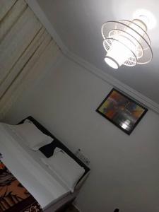 Postel nebo postele na pokoji v ubytování Meka Hotel