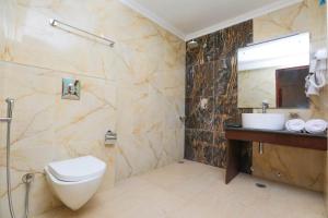 a bathroom with a toilet and a sink at Sky Desert in Leh +17 photos