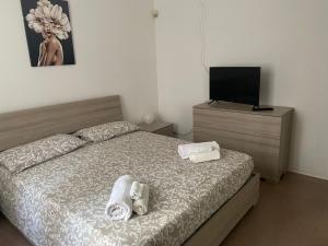 Posteľ alebo postele v izbe v ubytovaní PIRANDELLO HOME + 3 fotografie