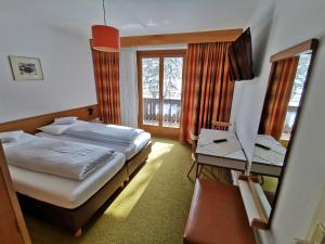 Posteľ alebo postele v izbe v ubytovaní Hotel la Plaza