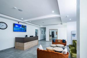 TV a/nebo společenská místnost v ubytování Quest Boutique Hotel
