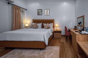 Postel nebo postele na pokoji v ubytování Quest Boutique Hotel + 37 fotografií