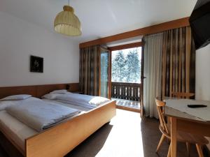 Posteľ alebo postele v izbe v ubytovaní Hotel la Plaza
