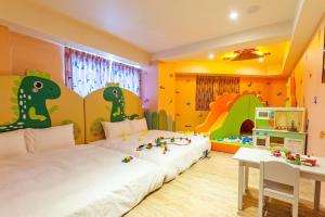 Postel nebo postele na pokoji v ubytování 童玩樂親子旅宿Toy Fun Hotel + 37 fotografií