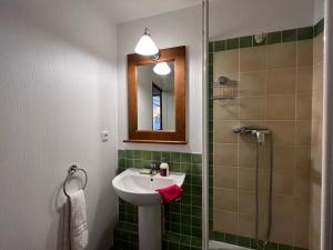 a bathroom with a sink and a shower and a mirror at L'Alpaga by Mountain Collection Immobilier in La Salle-les-Alpes +73 photos