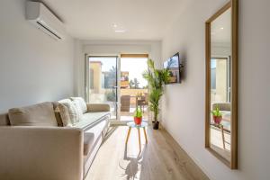 Televízia a/alebo spoločenská miestnosť v ubytovaní OleHolidays 326 Romana Playa vistas al mar