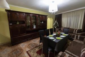 a living room with a table and a couch at Casa Nicula in Avrig