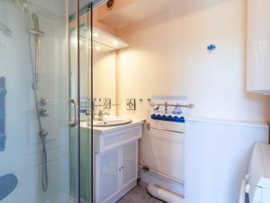 a bathroom with a sink and a shower at Apartment Les Maisons de la Mer by Interhome in Merville-Franceville-Plage