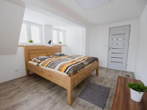 Un pat sau paturi într-o cameră la Holiday Home Tanvald by Interhome
