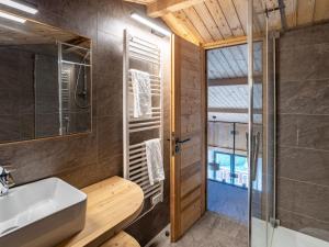 a bathroom with a sink and a shower at Holiday Home L'Adret by Interhome in Saint-Gervais-les-Bains