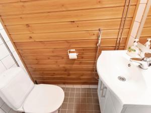 a bathroom with a white toilet and a sink at Holiday Home Ylläs chalets a104 by Interhome in Ylläsjärvi