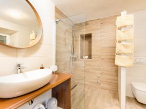 a bathroom with a sink and a shower at Holiday Home Paesana Heritage House by Interhome in Vrbnik