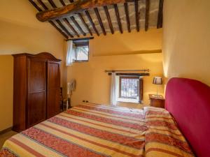 A bed or beds in a room at Holiday Home Il Feudo by Interhome