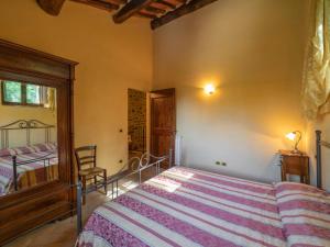 A bed or beds in a room at Holiday Home Il Feudo by Interhome