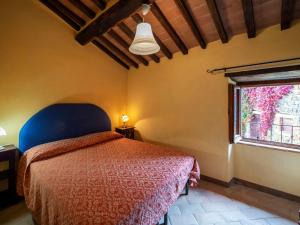 A bed or beds in a room at Holiday Home Il Feudo by Interhome
