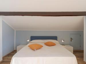 A bed or beds in a room at Apartment Gabriella by Interhome