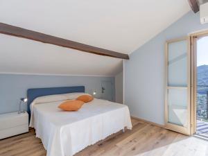 A bed or beds in a room at Apartment Gabriella by Interhome Még 15 kép