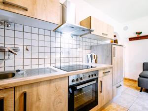 Η κουζίνα ή μικρή κουζίνα στο Apartment Cesa Minach-1 by Interhome