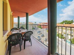 a balcony with a table and chairs on a balcony at Apartment Appartamento Pietrasanta by Interhome in Pietrasanta